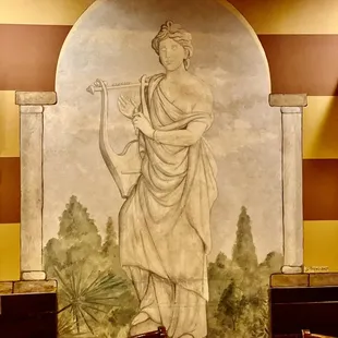 a painting on the wall of a restaurant