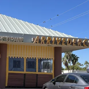 a car parked in front of a restaurant