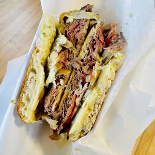 a sandwich with meat and cheese