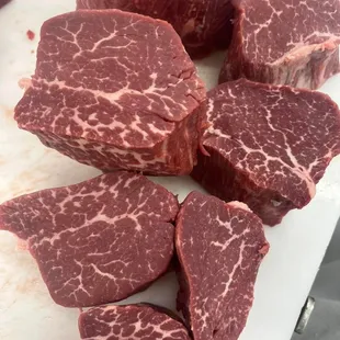 sliced steaks on a cutting board
