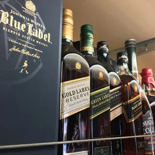 a shelf of liquor bottles