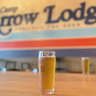 a glass of beer on a table