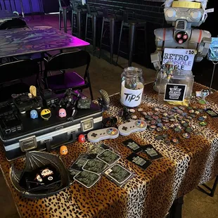a leopard print table with a laptop and other items