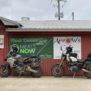 two motorcycles parked outside