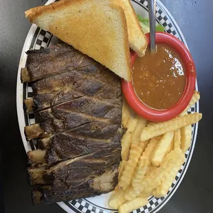 Half rack of ribs....so good they fell off the bone. Baked beans are so tasty!