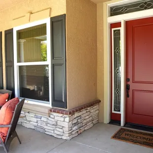 Front door painted in Eggshell shine, in this beautiful medium/dark red.