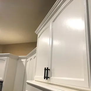 Latex painted cabinets, with satin finish.