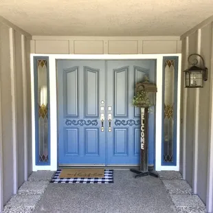 Front exterior door painted in a Sherwin Williams blue color.
