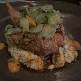 Chicken fried quail, Roquefort cheese polenta, hot honey, celery carrot salad.