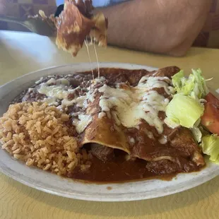 Beef Enchiladas with their signature red meat sauce