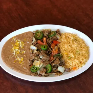 Selected cut steak, grilled onions, jalapeños and tomatoes.