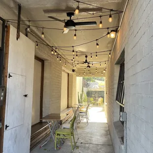 Outside walkway with some seating and shade