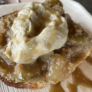 a piece of bread with butter and syrup