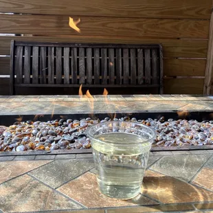 Fire pit drinking a Broken Hearts Cider.