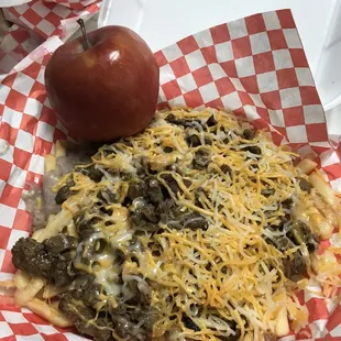 Half order of carne asada fries. It's a big order! (Apple for size reference)