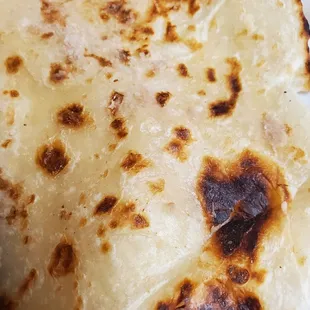 Inside of tortilla from bean burrito. Homemade, and grilled up first, definitely a plus.