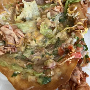 Taco salad ... Runny refried beans , partially cooked fatty chicken thighs and old lettuce. Disgusting