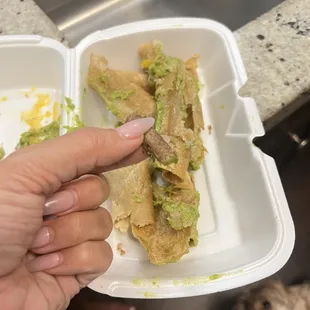 The meat inside my rolled taco. Tiny and dry