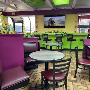 Dining area &amp; TV that shows video &amp; plays music