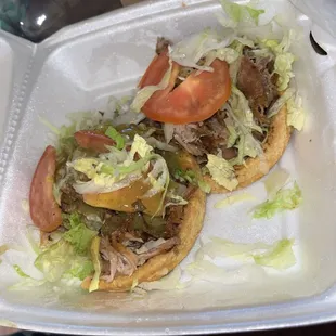 2 Sopes of carnitas no cheese no sour cream  Delicious !!
