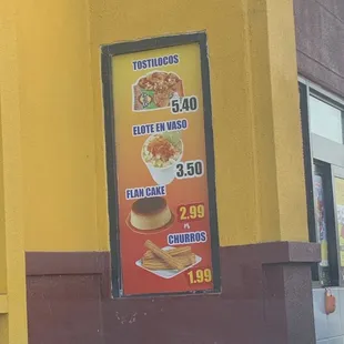 a menu on the side of a building