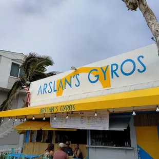 The store front on a bright summer day.