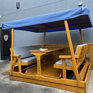 Outdoor patio booths that actually swing back and forth! So cool!