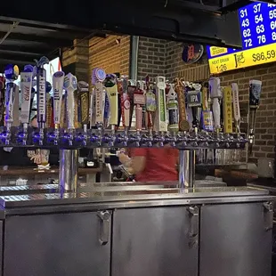 a bar with beer taps