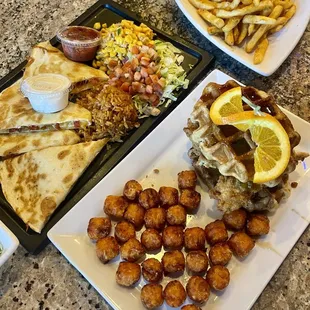 Quesadilla, side of fries, chicken and waffles.