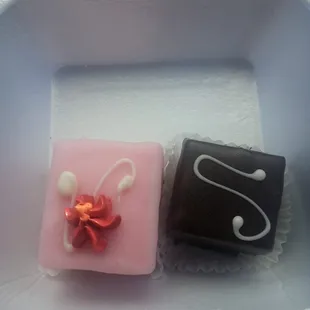 two chocolates in a styrofoam container