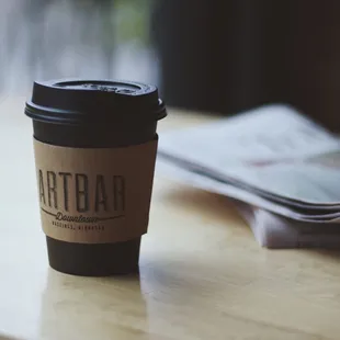 a cup of coffee on a table