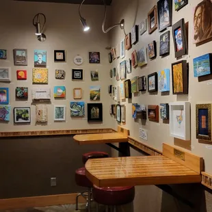 a variety of paintings on the wall