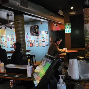 a man sitting at a table in a restaurant