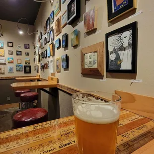 a pint of beer on a wooden table
