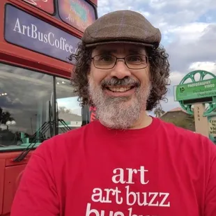 a man in a red shirt and hat