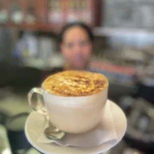a cup of cappuccino on a saucer