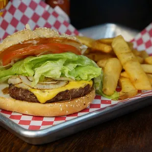 a cheeseburger and fries on a tray