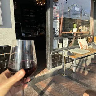 a person holding a glass of wine