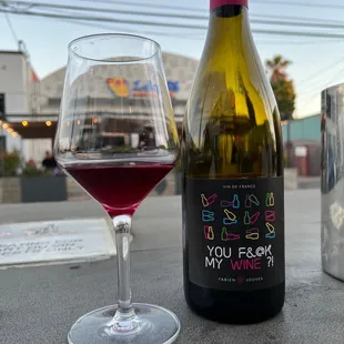 a glass of wine and a bottle of wine