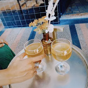 2 glasses of happy hour orange wine