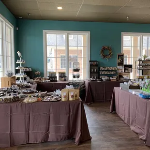 a large room with tables covered with food