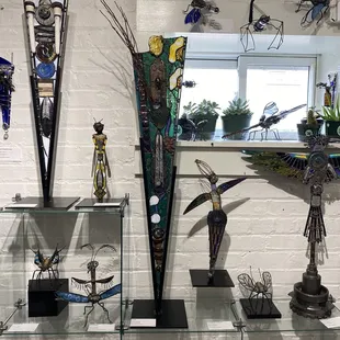 I love the creativity in these stained glass, gem stone and found objects pieces.