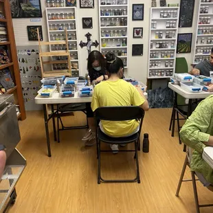 Customers designing and creating their own glass mosaics