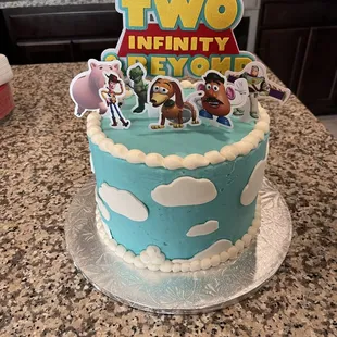 a two - tiered birthday cake