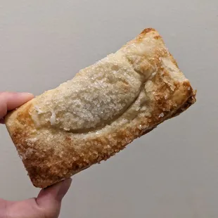 Smiley, flaky pineapple turnover, topped with sanding sugar, was filled with sweet and chunky pineapple.