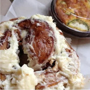 Huge iced cinnamon roll and yummy veggie quiche.