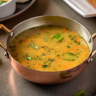 a bowl of soup and bread