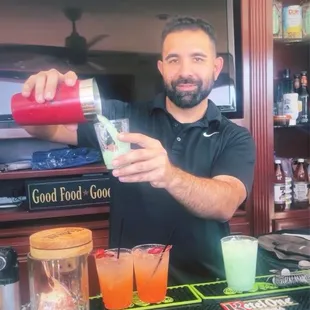 Blue Hawaiians and Strawberry Moscow Mules.  P.s. Tony shakes all his drinks!! :)