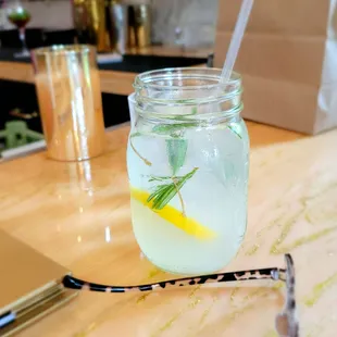a glass of lemonade on a table
