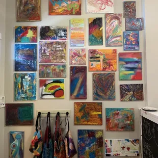 Paintings and bags for sale.